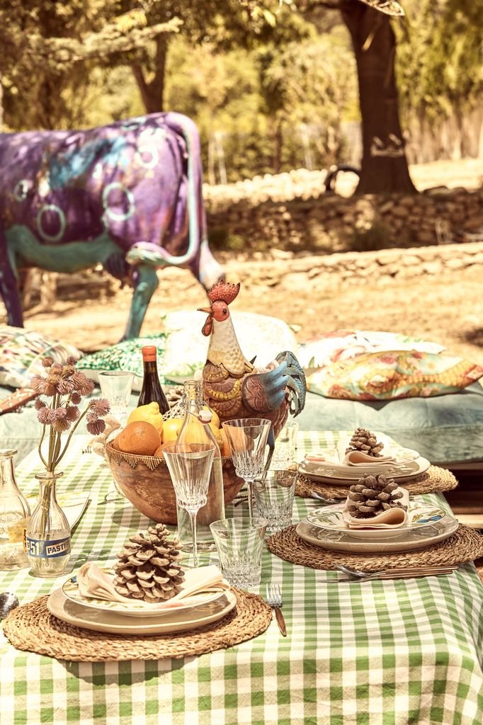 Set table at Macarena and Aldo's house with wild flowers