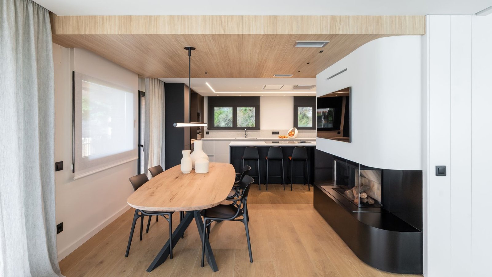Wooden ceiling for zoning in an open plan