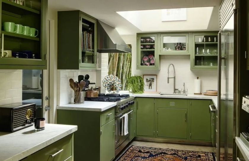 Sage-coloured kitchen in Dakota Johnson's home