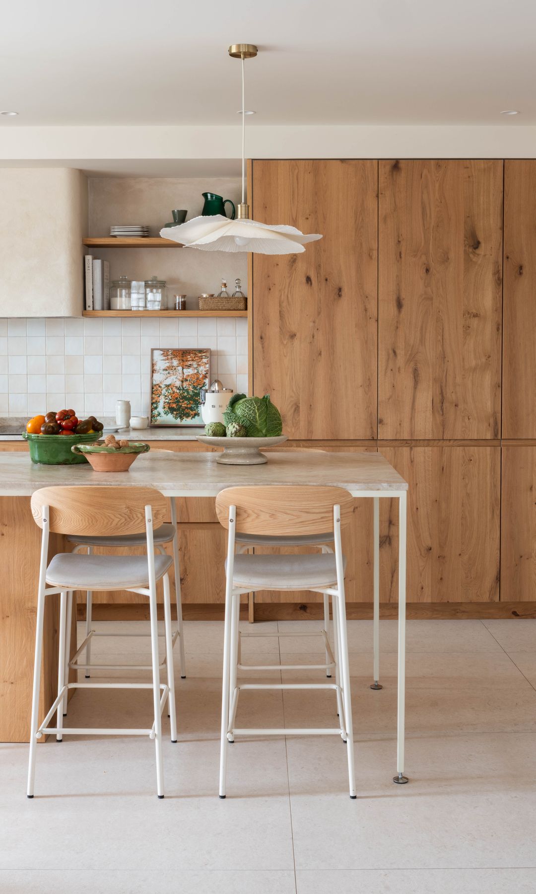 Renovated kitchen with oak cabinets and a central island
