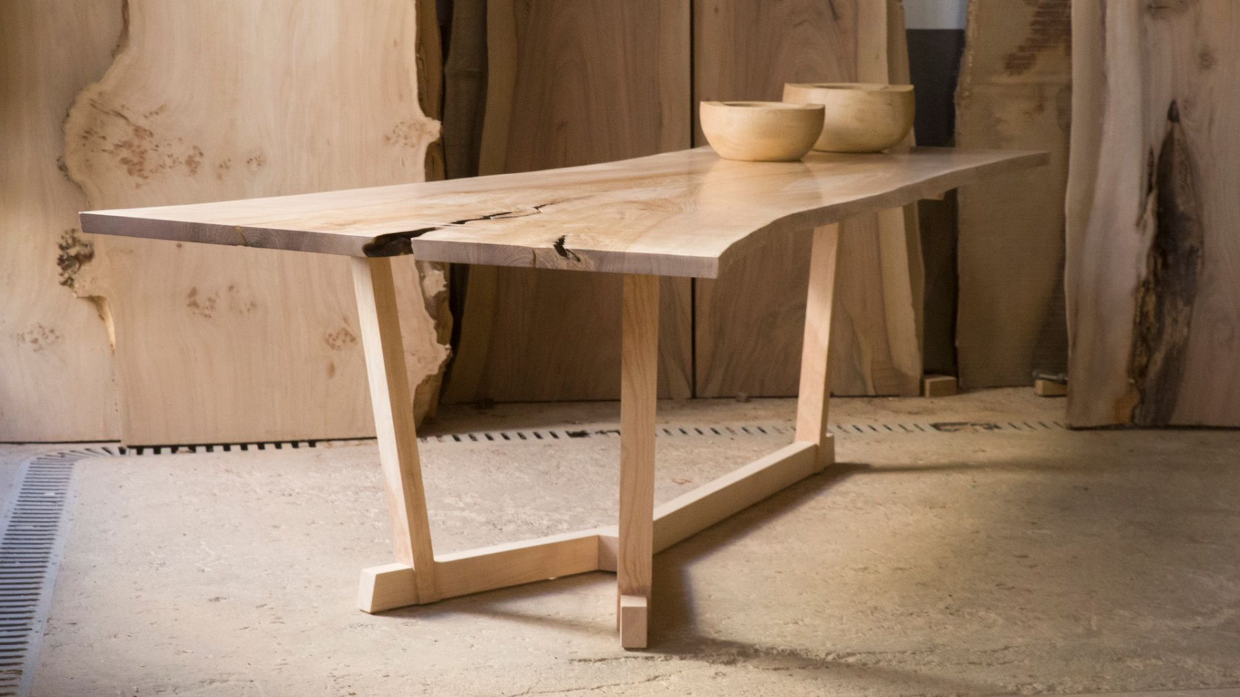 Solid wood table with visible grain in a workshop